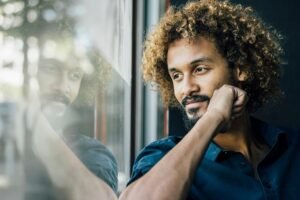 Man reflecting on the way he communicates, what we often help you do during our Communication Skills trainings.