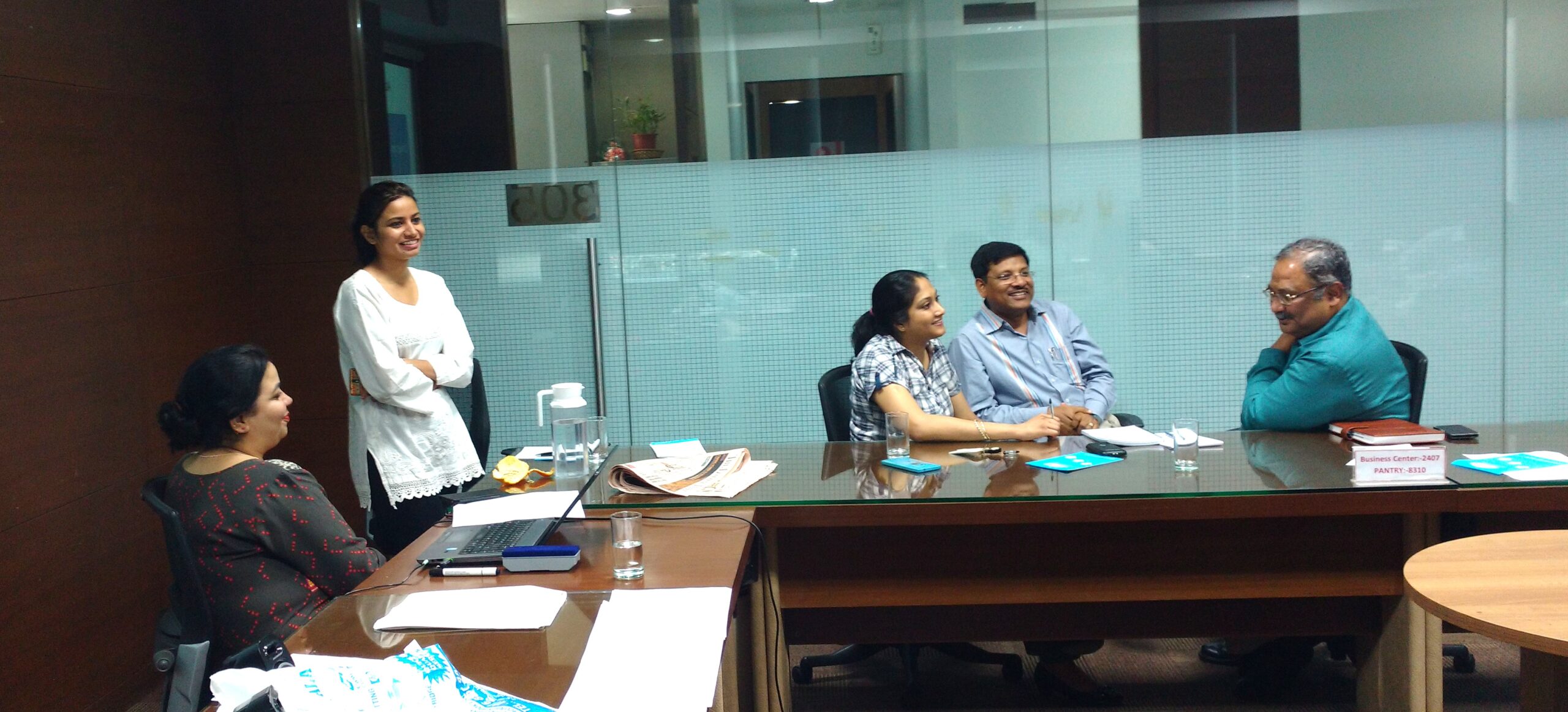 Having discussions with participants during a Training Need Identification Intervention.